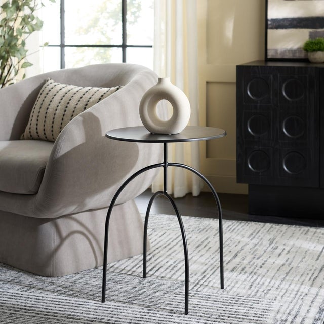 Presenting our Saburo Accent Table. Delightfully designed, this chic yet practical accessory comes dressed in bold black....