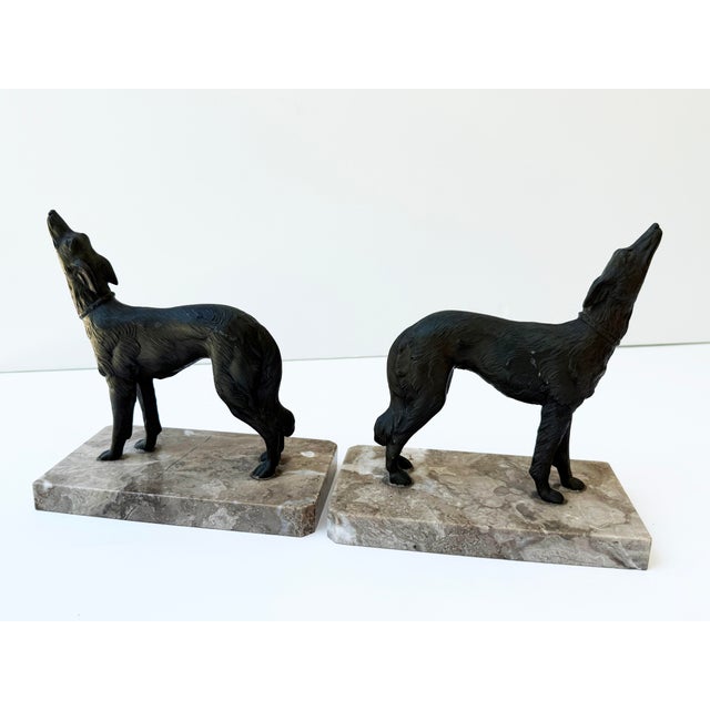 An elegant pair of antique French Art Deco bookends featuring finely modeled Borzoi figures mounted on substantial veined...