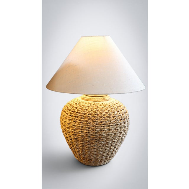 Up for grabs here is a pair of table lamps from lombok. Made with hand woven natural rattan wrapped around ceramic vase....