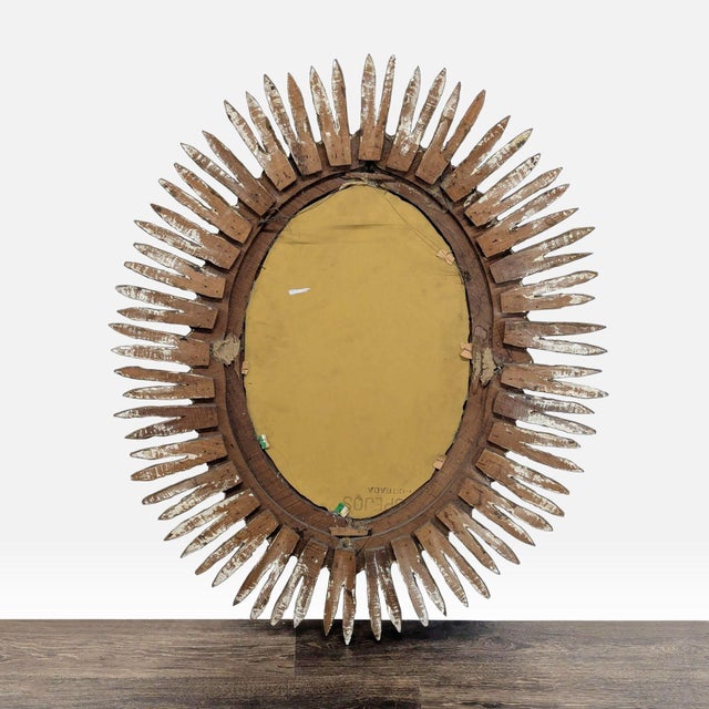 Oval giltwood wall mirror. Original Price: $2100. Dimensions (in): 33W x 4D x 39H.