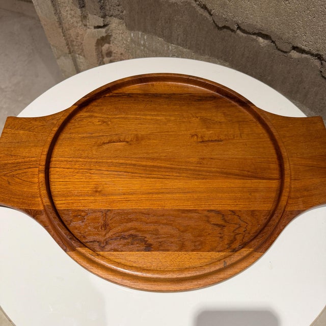 For your consideration, a mid-century modern Dansk Designs serving tray made of teak wood, designed by Jens Quistgaard in...