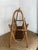 Large vintage magazine rack in rattan and bamboo, an iconic storage accessory from the 1960s/70s. It features a...