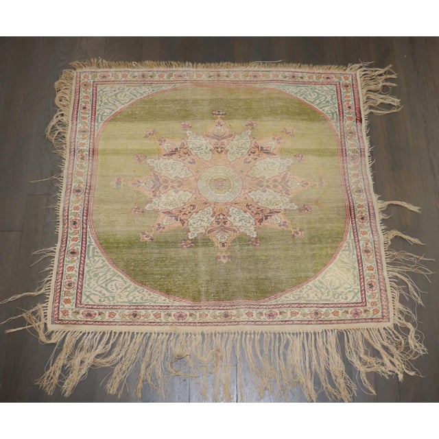 an early 20th Century worn green color Silk Keysari Square Rug