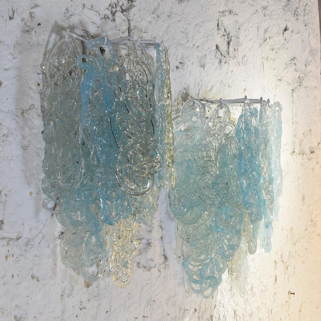 Pair of sculptural wall lamps in the Vistosi style of the 1960s, each composed of fifteen blown Murano glass pieces...