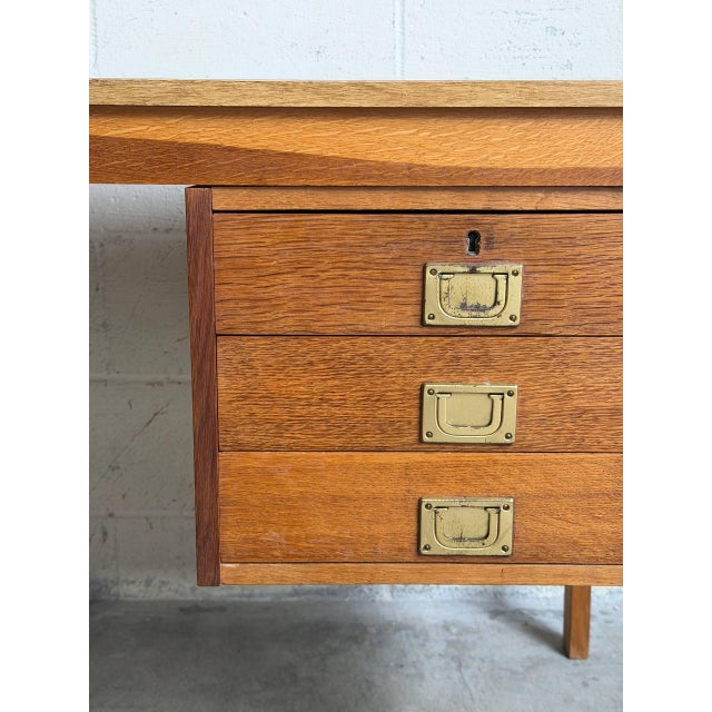 Crafted in warm teak veneer over solid wood construction, this elegant Scandinavian desk features a minimalist silhouette...