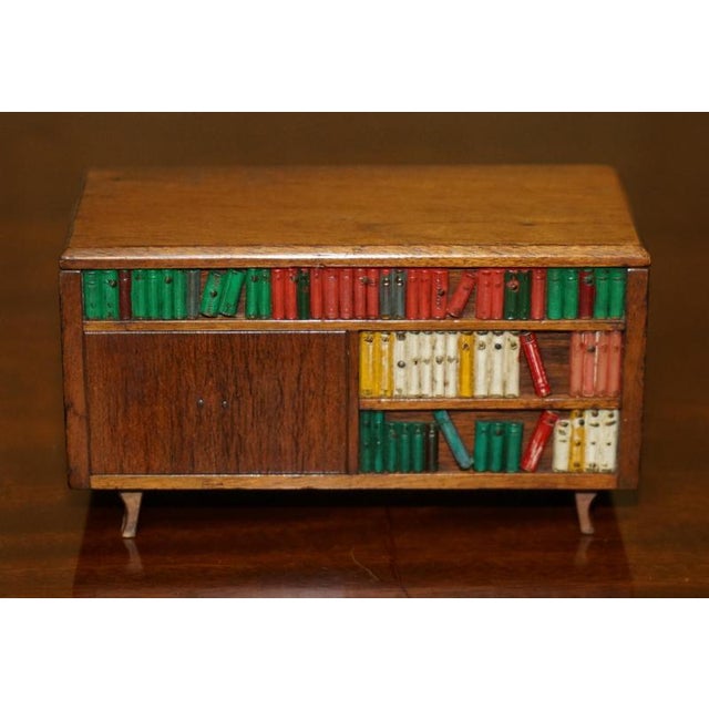 Folk Art musical Cigarette or Cigar dispenser circa 1970’s Dimensions Height:- 9.5cm Width:- 17.5cm Depth:- 7.5cm