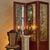 Sourced in Paris, a 20th century French three-panel folding screen with richly mottled antiqued mirror glass panels. Set...