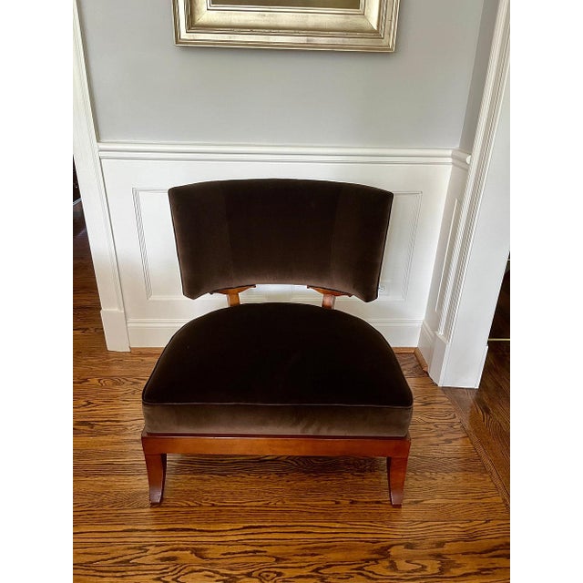 This curved back chair in mahogany and chocolate brown velvet provides glamorous low seating for contemporary or...