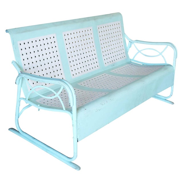 Pair of Mid-Century Modern outdoor settees crafted from tubular steel and finished in a cheerful aqua teal paint. Each...