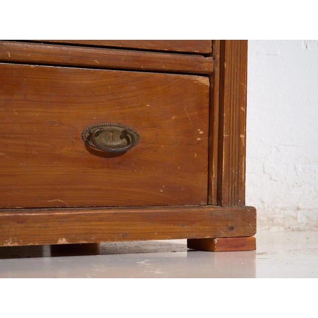 Antique central european four-drawer chest of drawers in cherry-stained wood, made in central europe in the early 20th...