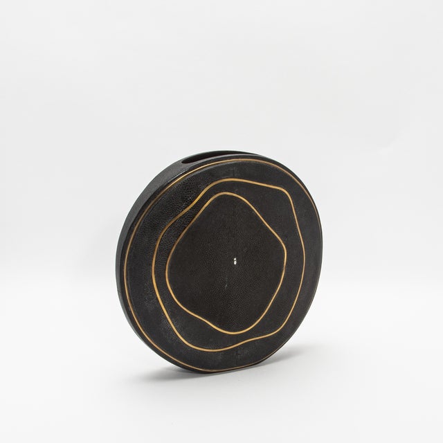 This exquisite vase by R&Y Augousti captures the essence of artisanal craftsmanship with its luxurious shagreen surface,...