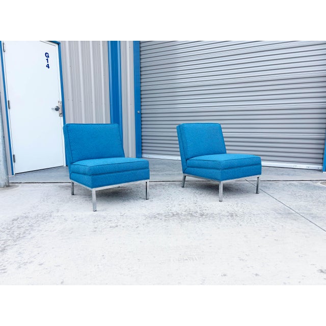 Mid-century lounge chairs styled after Florence Knoll, manufactured in the United States, circa 1960s. This elegant pair...