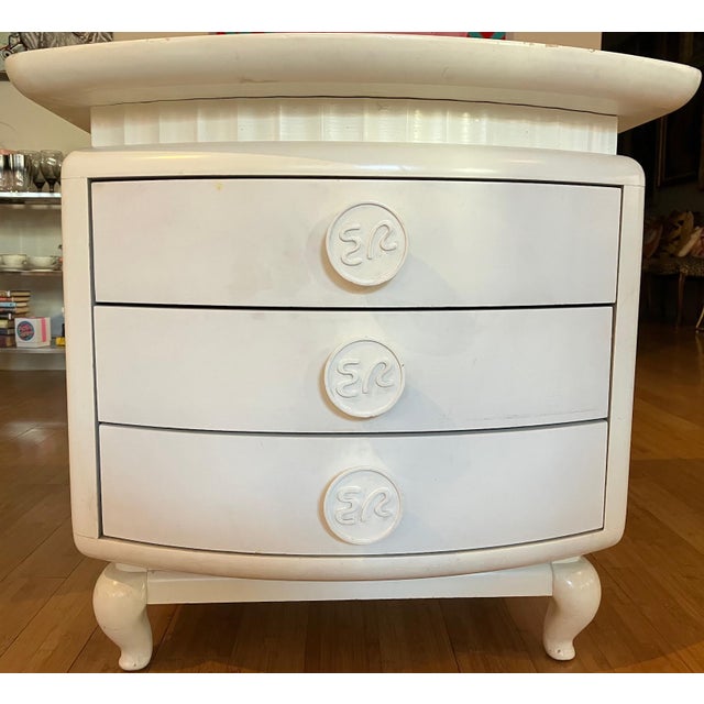 Neo-Baroque confections from a maestro of 1950s Miami modernism. These three-drawer side tables have three bow front...