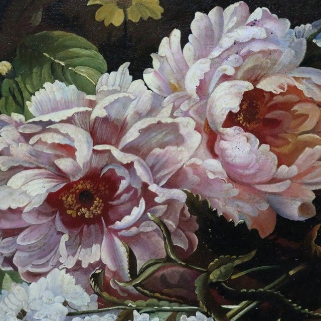 This antique Continental oil painting on board, dating to approximately 1880, depicts a vibrant floral still life. The...