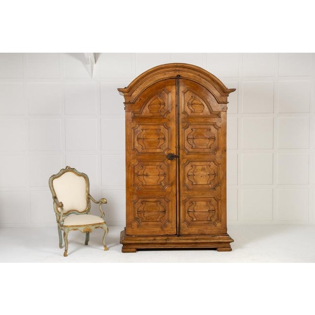 A Majestic, Large 18th Century Italian Pine Armoire/Cabinet with a Domed Top. Of large scale, this cabinet has a domed top...