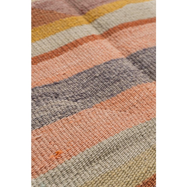 This vintage Turkish flat weave Kilim is hand-woven. The simplicity and boldness of this piece can also give a...