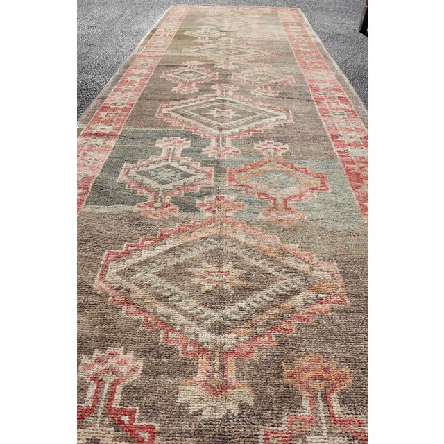 Measures: 3'2 x 13'11 Turkish Oushak Runner with Coral Red and Taupe Geometric Medallion Design. Keivan Woven Arts. rug...