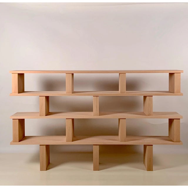 Four shelves 'Verticale' polished oak shelving unit. Highest quality solid oak construction. Comes in 2 parts connected...