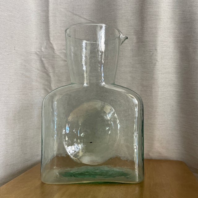 Blenko Glass Company Water Bottle in clear crystal, designed by the brand and widely considered a collectible art glass...