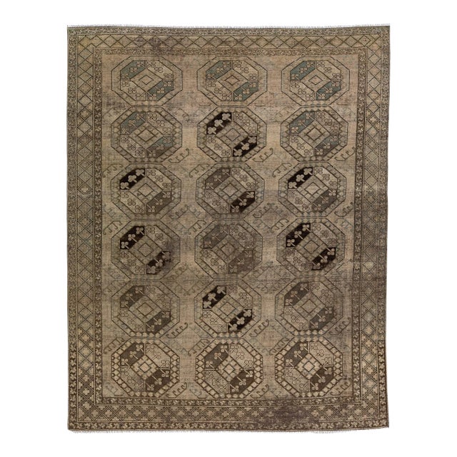 1930s Antique Handmade Persian Turkmen Wool Rug With Geometric Motif in Light Brown For Sale