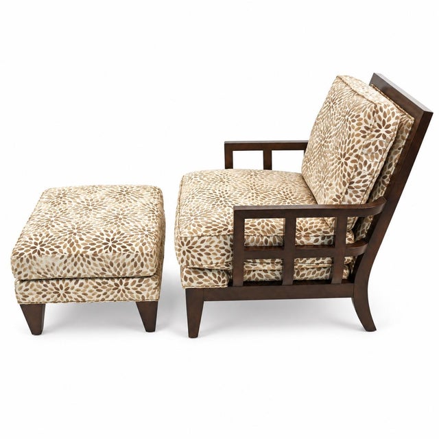 This is a modern architectural carved walnut club chair with matching ottoman attributed to Berman Rosetti out of...