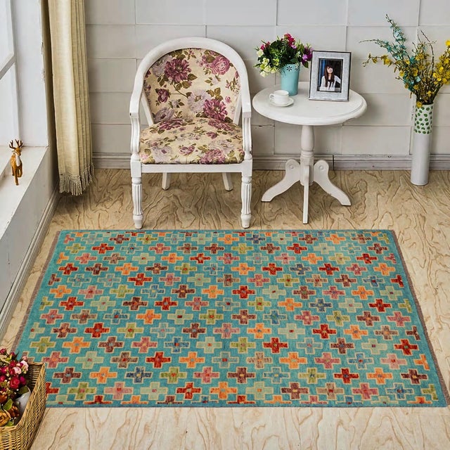 This stunning hand-knotted Afghan Balouchi rug is a captivating addition to any decor. Crafted by skilled artisans, it...