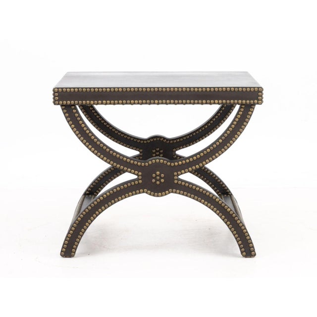 Baker Alexandre Brown Leather Brass Riveted Stool, designed by Jacques Garcia, on x-form base. 20" H x 22" W x 24" D....