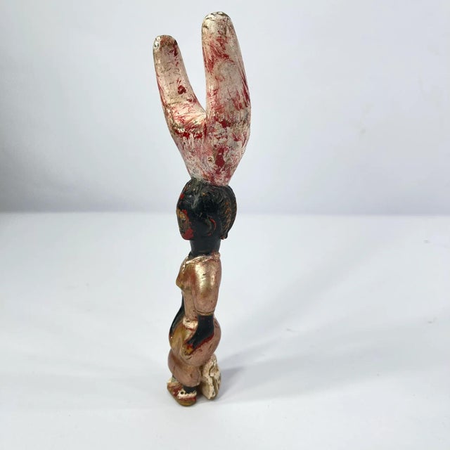 The Baule Figural Slingshot, a stunning piece of African art that showcases the skillful craftsmanship and cultural...