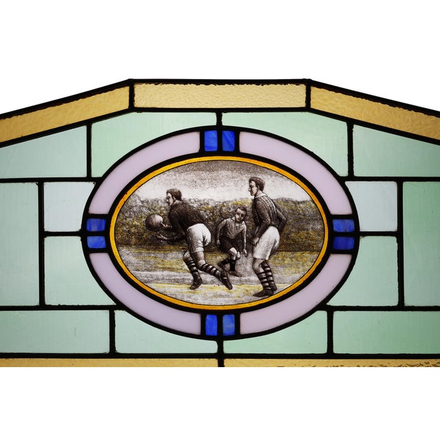 A rare and evocative example of early 20th-century Belgian stained glass, this panel, crafted circa 1910, captures the...