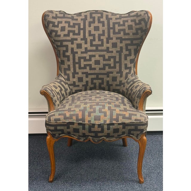 Stunning Vintage Wingback Chair in excellent structural condition. This statement piece beautifully combines classic...