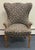 Stunning Vintage Wingback Chair in excellent structural condition. This statement piece beautifully combines classic...