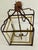 Vintage metal lantern shape chandelier , square domed shape. 4 lights with 2” central glass sphere hanging. Gold tone...