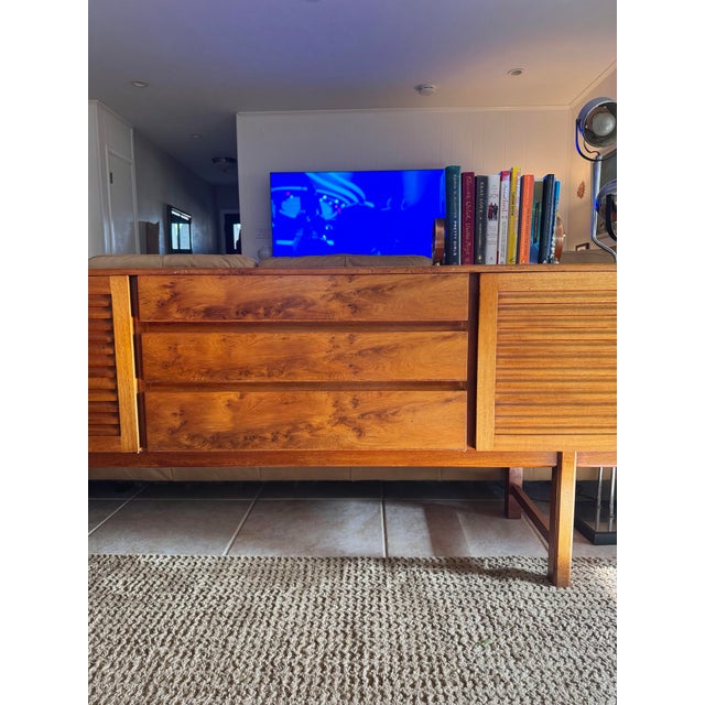 A rare Scottish “Shetland”sideboard by A.H. McIntosh, circa 1960s. Featuring burl drawers, clean proportions, and a...