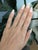 This elegant diamond band features a refined row of sparkling diamonds set in solid 14K gold, accented with delicate...