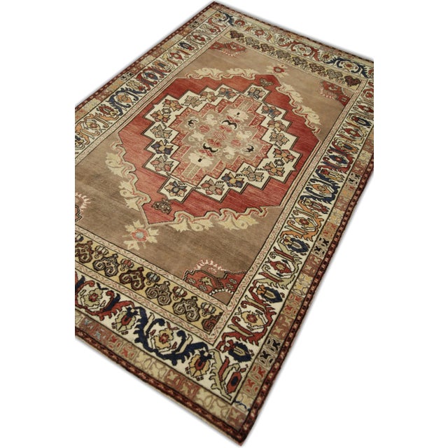Introducing a one-of-a-kind vintage Turkish hand-knotted wool rug, carefully crafted by skilled artisans using traditional...