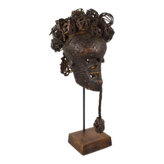 Early 20th Century Salampasu Copper Sheeting Mask with Jagged Teeth on Custom Stand For Sale