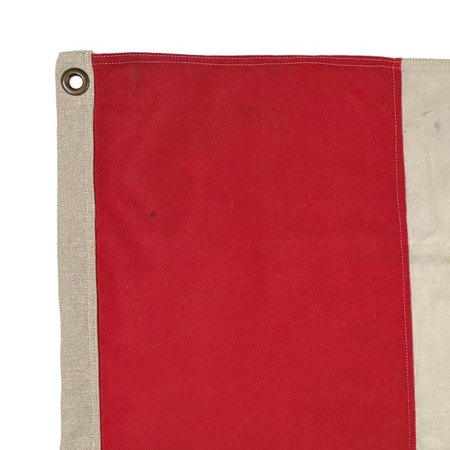 This vintage nautical signal flag is fully sewn from a thin cloth, possibly a blend of wool and synthetic fiber. New...