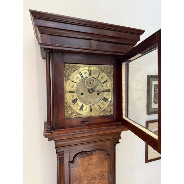 This Circa 1820 Brass Face English 8 Day Grandfather Clock is a classic and antique piece that adds charm to any room....