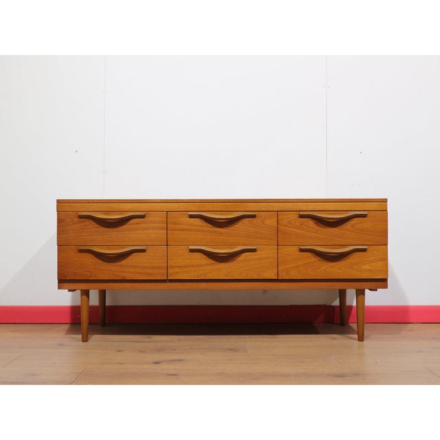 This Mid Century Modern Vintage Teak Dresser Drawers by Stonehill Danish Style is a beautiful dresser that combines...
