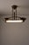 A rare, architectural ceiling fixture that marries genuine Art Deco design with early fluorescent lighting technology. The...