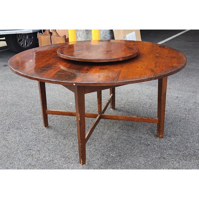 This is a very good mid 20th century shop made 60 inch diameter circular American pine dining room table with inserted...