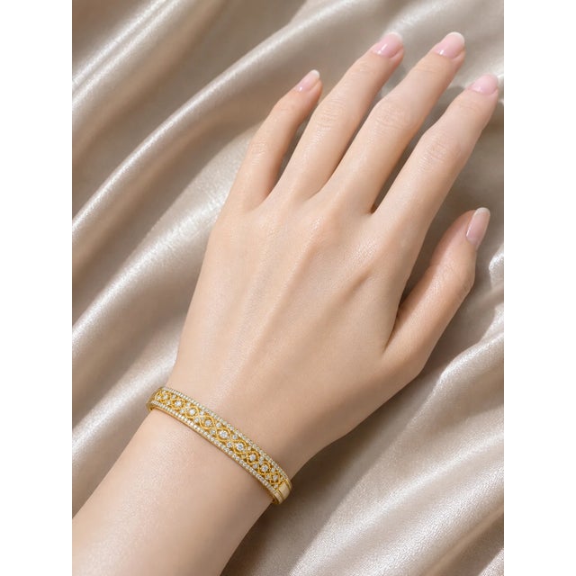 Add elegance and sparkle to your collection with this 14K Mildred rose pink gold statement bangle bracelet. Featuring...