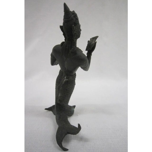 Antique bronze Thai figure of a "Merman" Dark verdigris finish, it measures 7"H x 5"W x 2.5"D and is in excellent condition.