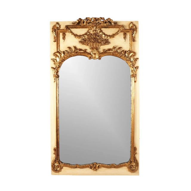 A gorgeous Vintage Neoclassical Style Giltwood Trumeau Mirror with floral, foliate, and scroll decoration in an off white...