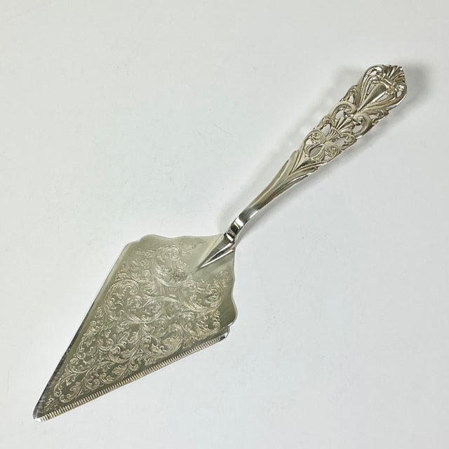 From Italy, this is a large pie or cake server. Perfect for use at a wedding or birthday party. The handle is raised for...