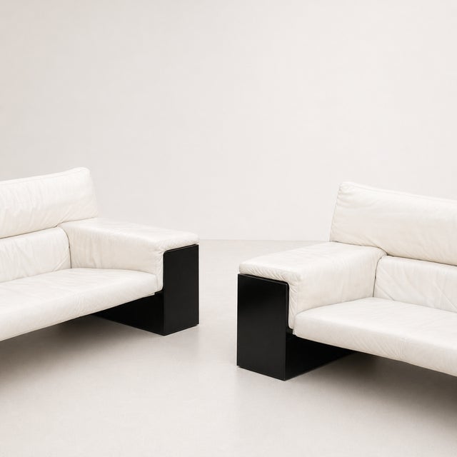 A pair of Brigadier sofas, designed by Cini Boeri for Knoll International. The frame is made of glossy black lacquered...
