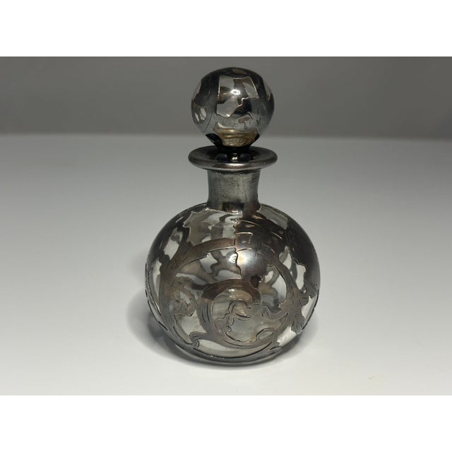Art Nouveau Sterling Silver Overlay Perfume Stopper Scent Bottle for your consideration. The bottle measures approx. 4...