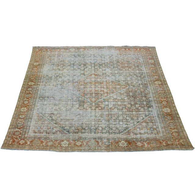 Beautiful Antique Mahal hand-knotted wool rug with a rust color field. This Persian rug has classic blue, gray, beige, and...