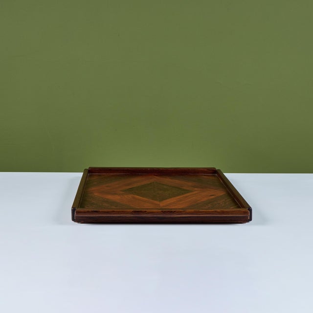 Serving tray by Don Shoemaker for Senal of Mexico. The tray has a dark rosewood frame with integrated handles at either...