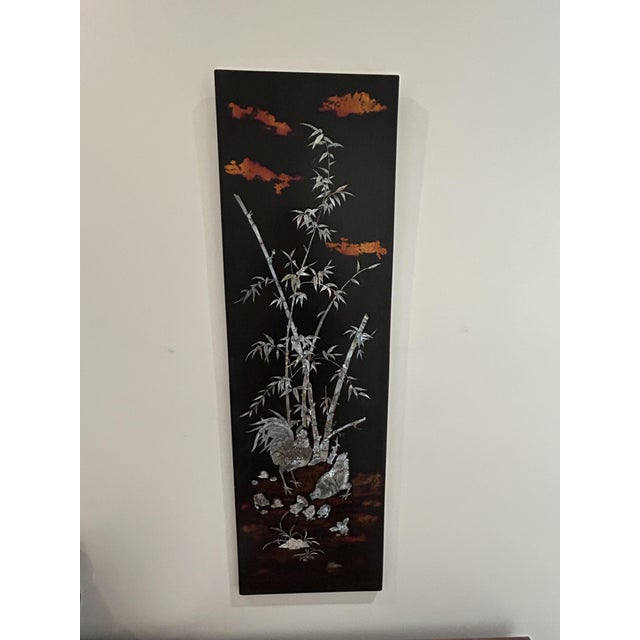 Elegant decorative panel in Vietnamese lacquer, likely made in the second half of the 20th century. This piece features a...